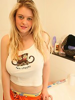 Busty blonde brushes her teeth